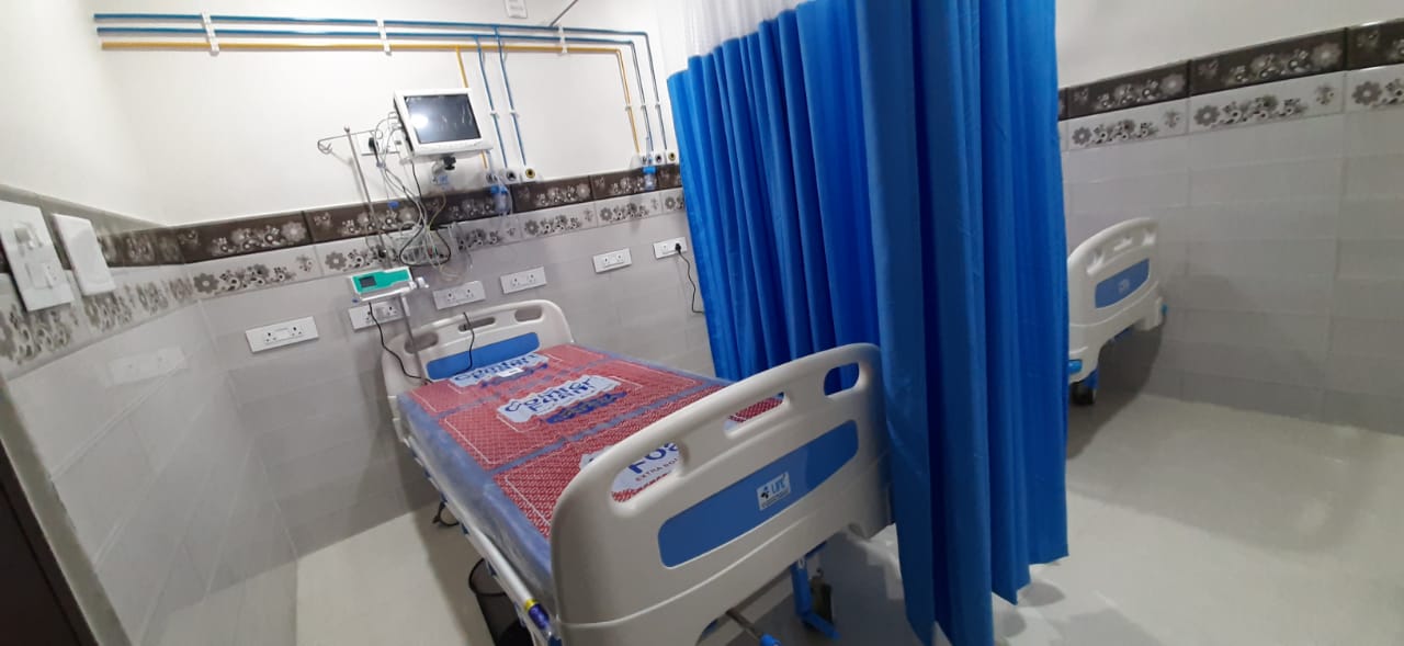 ICU bay with curtain partitions